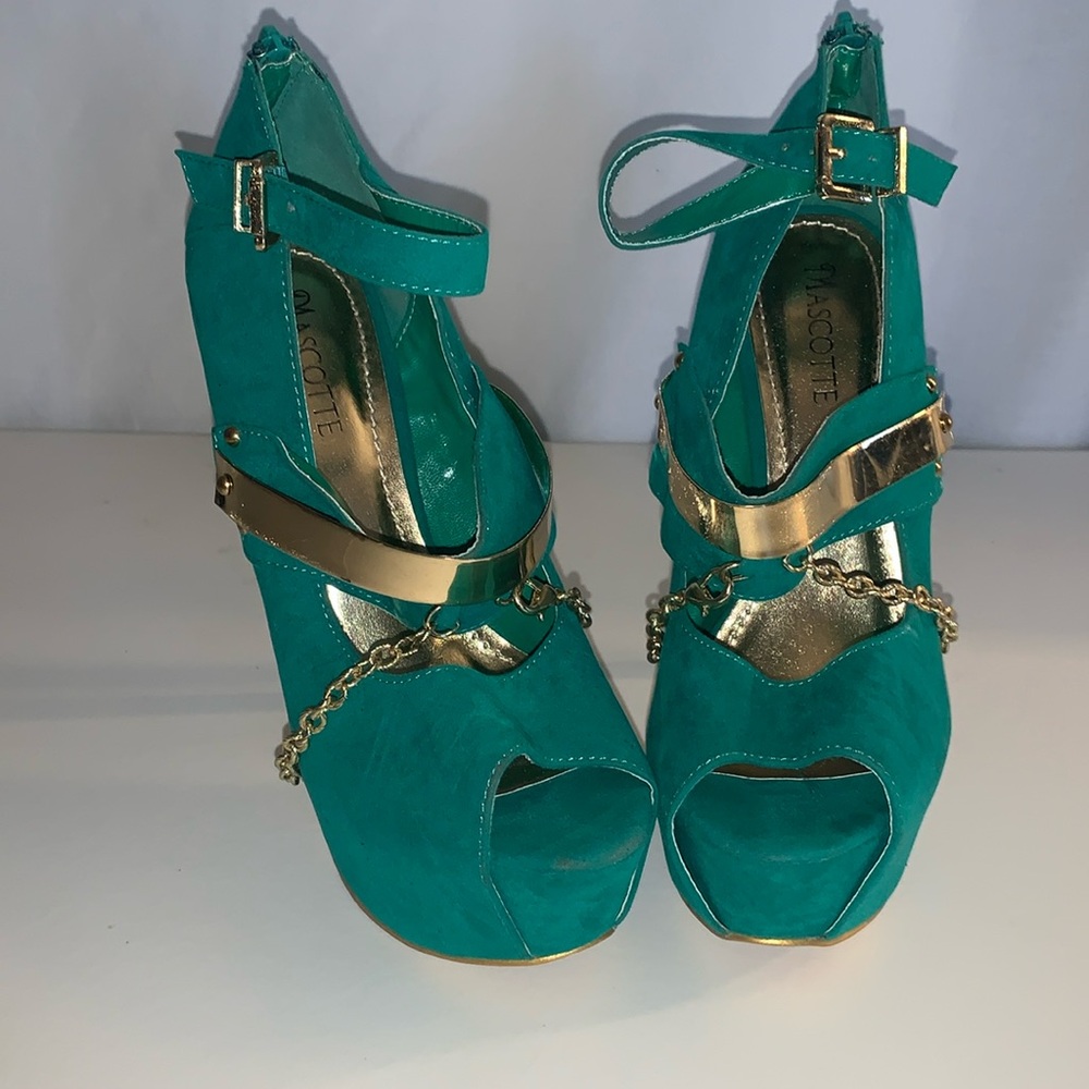 Green and gold suede heels.